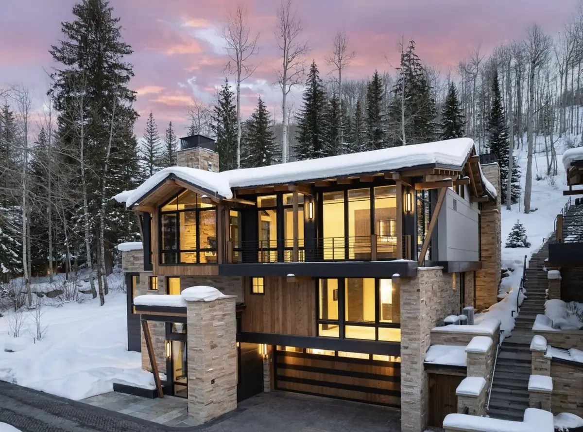 Vail Valley mountain home in early winter snow at the start of ski season, Colorado