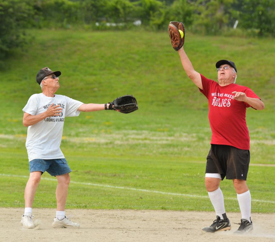 JERREY ROBERTS Tom Lucia, right, catches a hit beside Vic Tidlund. - JERREY ROBERTS | DAILY HAMPSHIRE GAZETTE