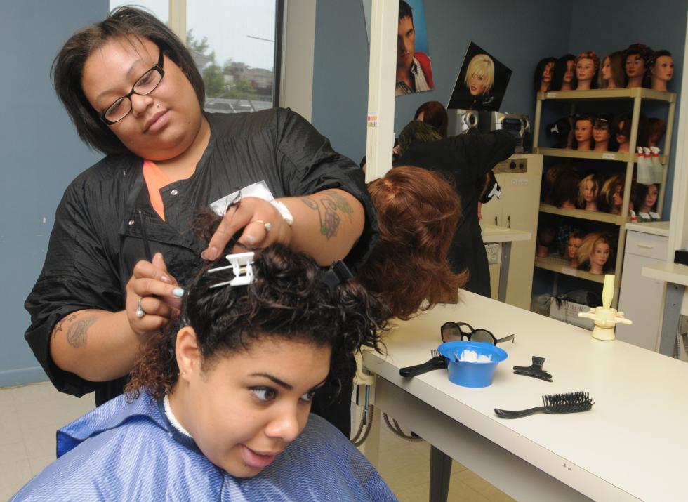 CAROL LOLLIS Sharie Loving,28,of Springfield, works on Fransheska Lopez,18, of Springfield hair. Both are students at Kay Harvey Hair dressing Academy in West Springfield. - Carol Lollis | Daily Hampshire Gazette