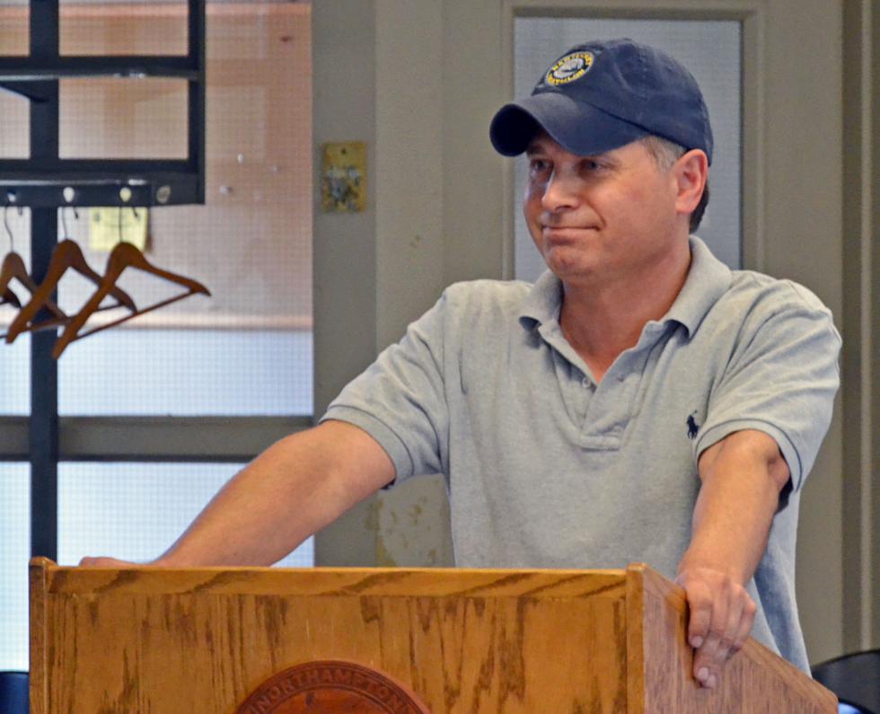 YOSHITAKA HAMADA Eric Suher stands behind the podium during the City of Northampton License Commission meeting at the City Council chambers in the downtown Northampton Wednesday, Aug. 6, 2014. - Yoshitaka Hamada | Daily Hampshire Gazette