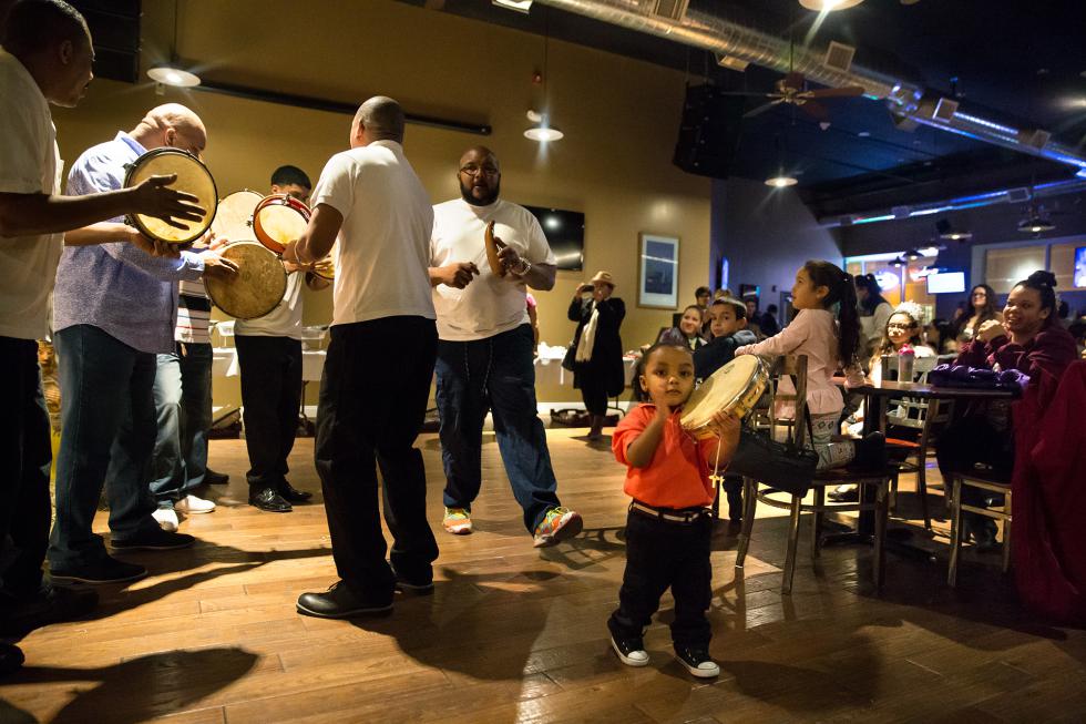 DAN LITTLE Women of the Vanguard members joined with the North End Community Alliance host a Three Kings Day celebration Wednesday at the International Biergarten on Main St. in Springfield. - DAN LITTLE | DAN LITTLE