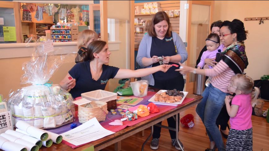Angie Gregory, an owner of Simple Linen and Diaper Service, a cooperative in Holyoke, spreads awareness of the company.