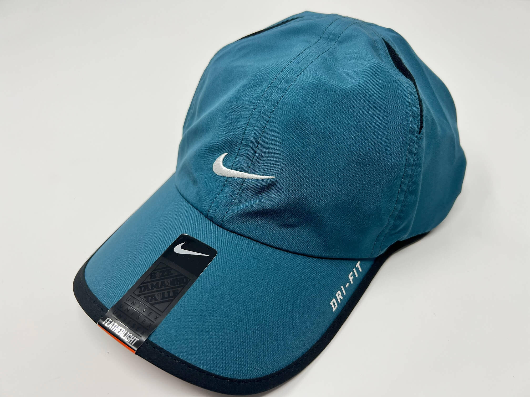 Blue Nike Dri-FIT cap with logo.