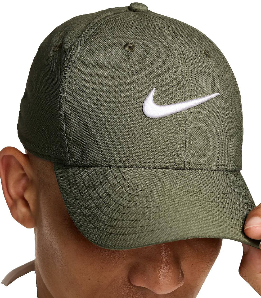 Person wearing green Nike cap.