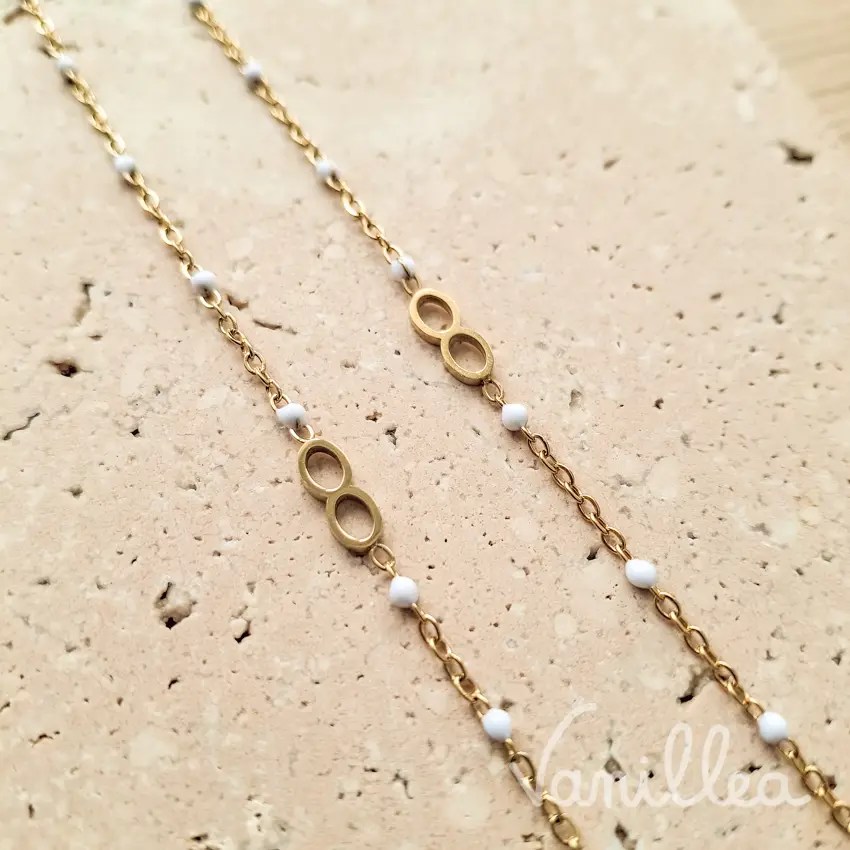 bracelet infini femme doré avec perles blanches