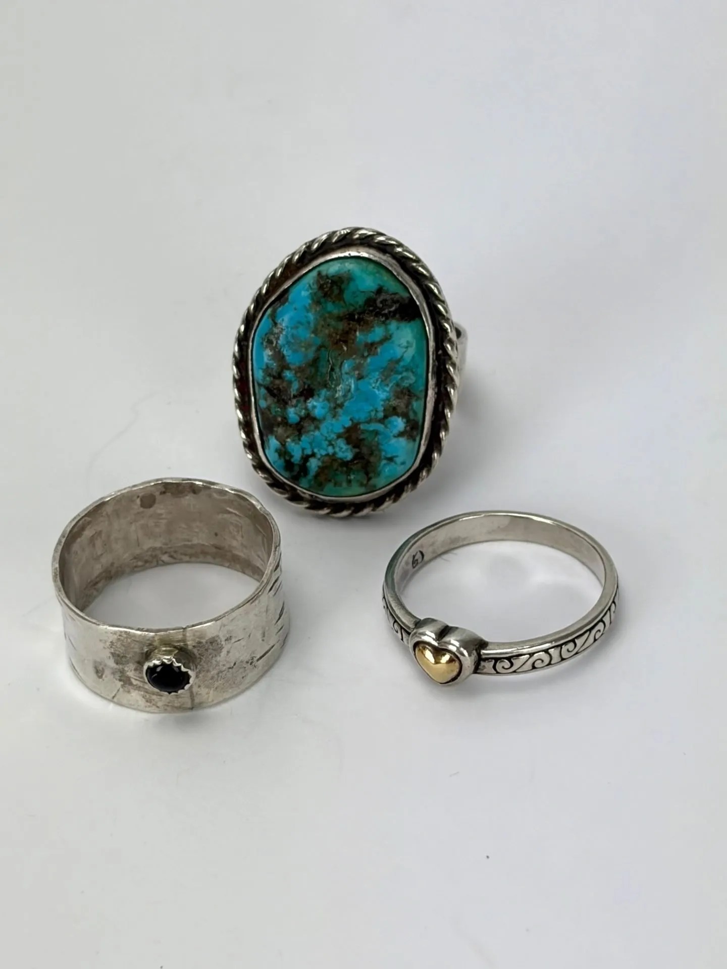 Lot 99:  Three Sterling Rings in sizes 8.5-9.