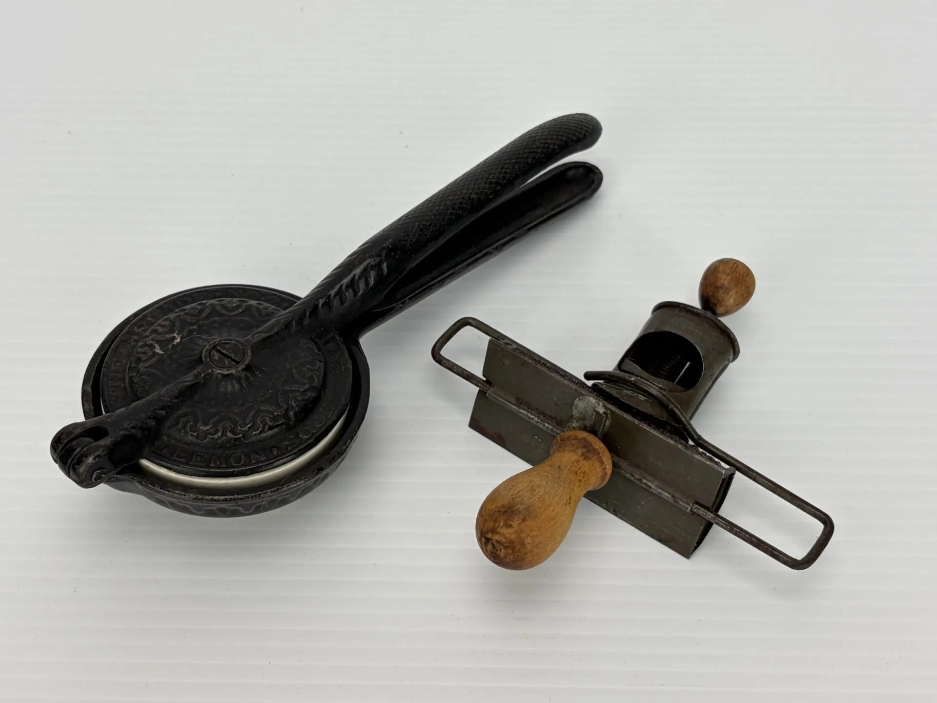Lot 74:  Antique Cast Iron & Porcelain Lemon Squeezer & Nut Grater.