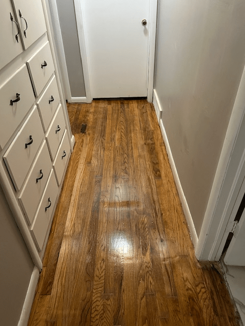 Hallway hardwood floor refinishing in Lawton OK by VCV Services