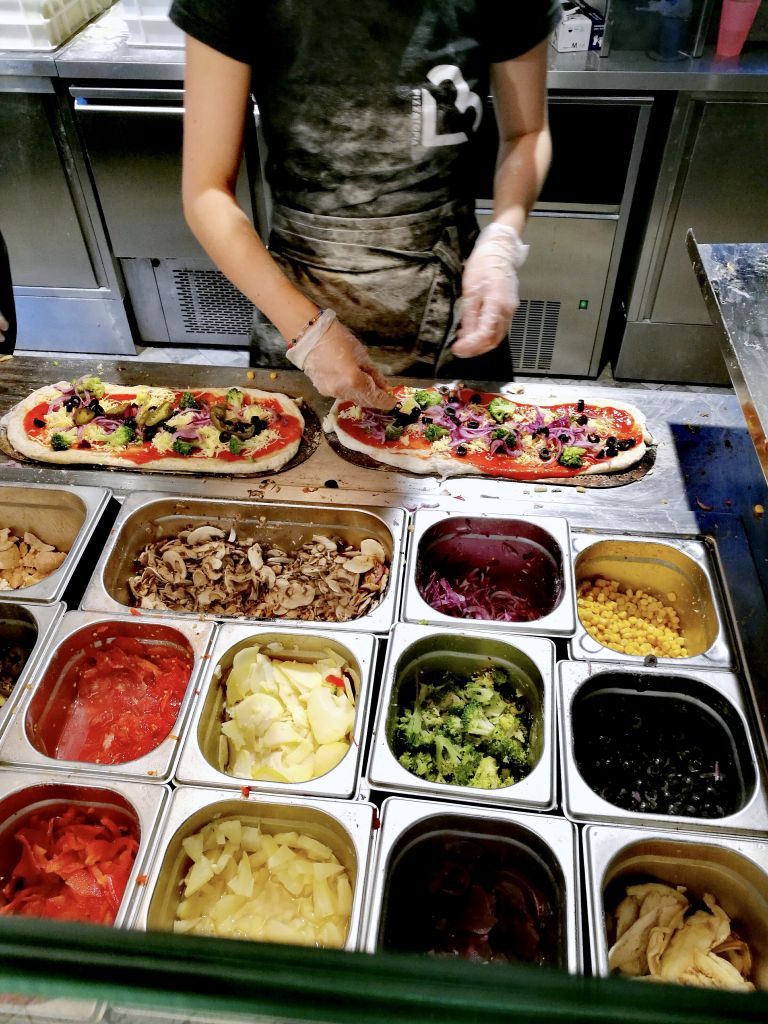 Restaurant in Krakow Making Pizza