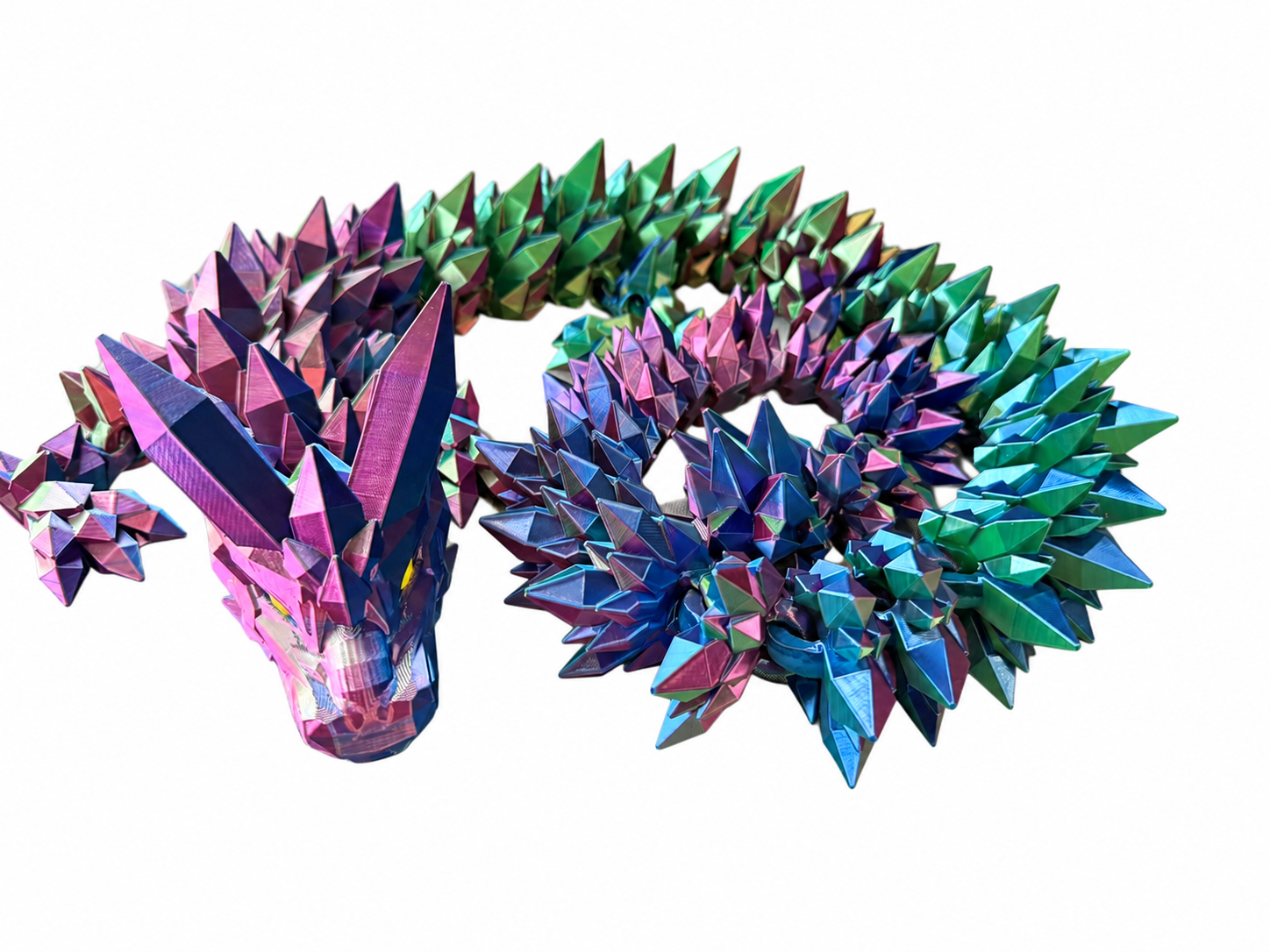 Blue, purple and green articulated crystal dragon with faceted spikes on a white background