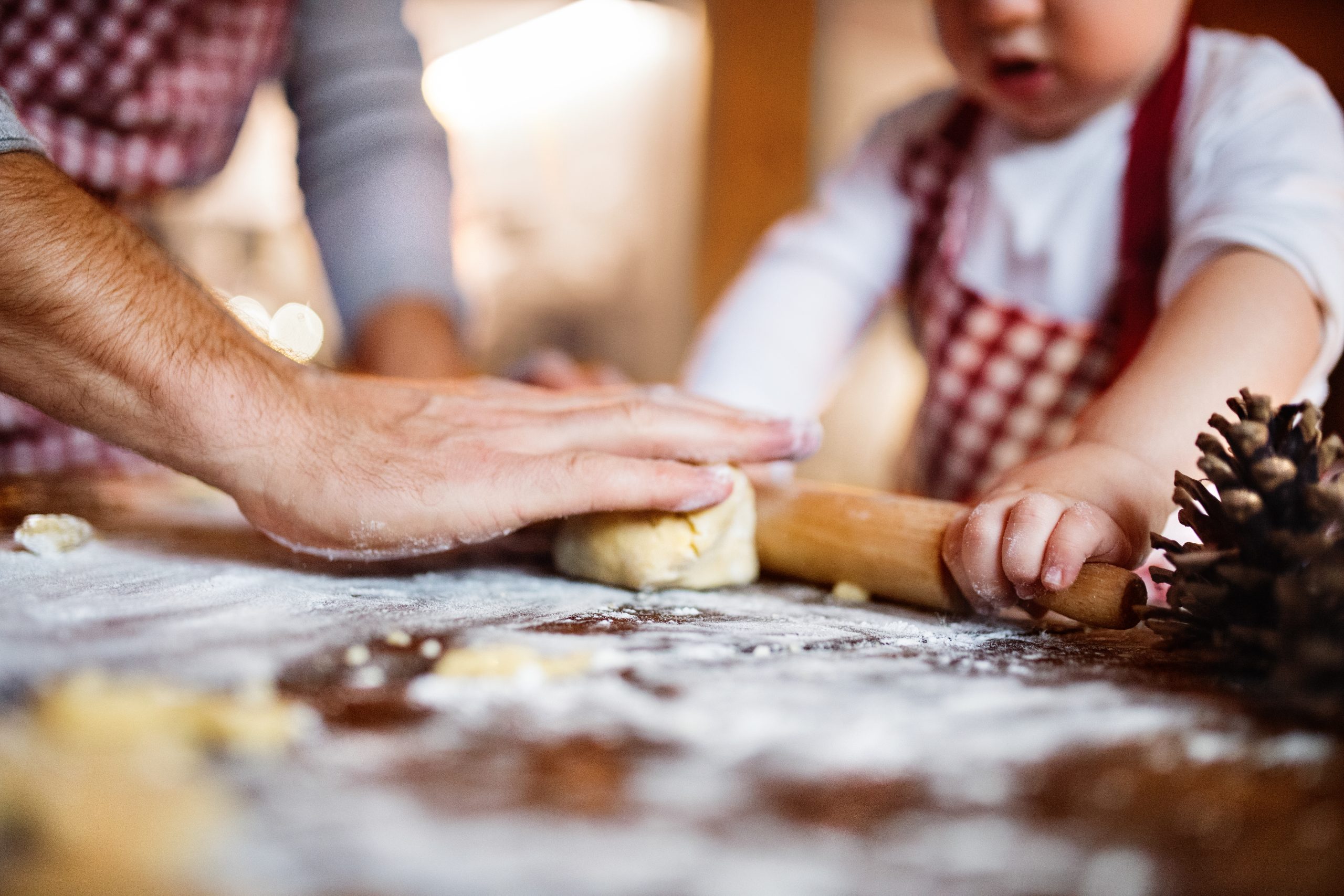 Father and son baking gingerbread cookies. 