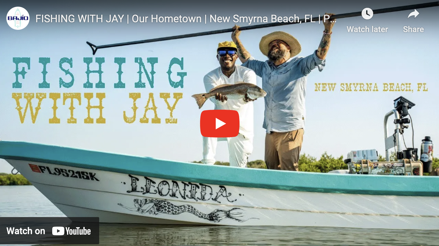 video cover image of two anglers on a boat celebrating a redfish