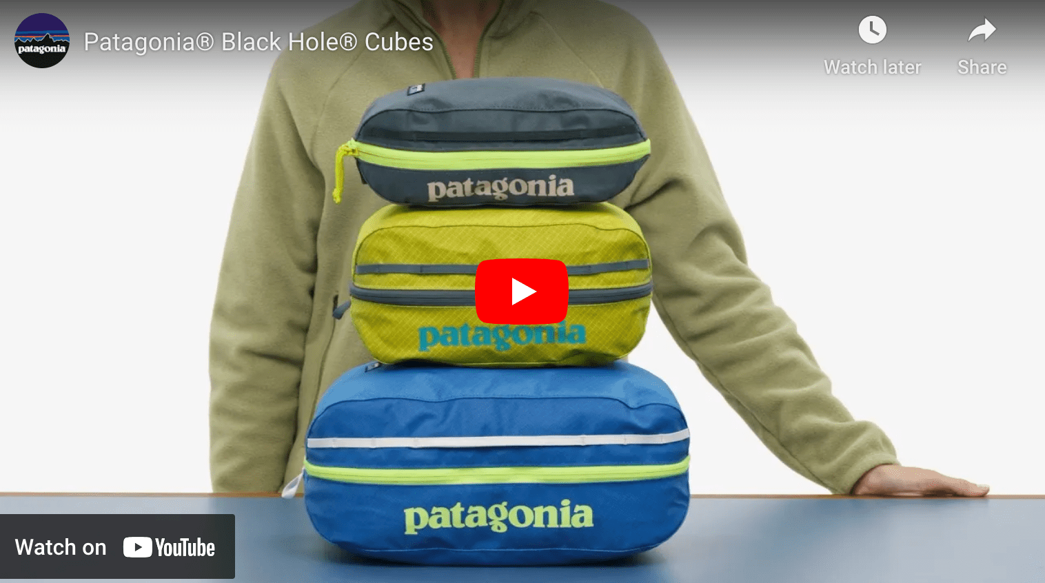 video cover image of a man standing behind a stack of Patagonia Black Hole Cubes