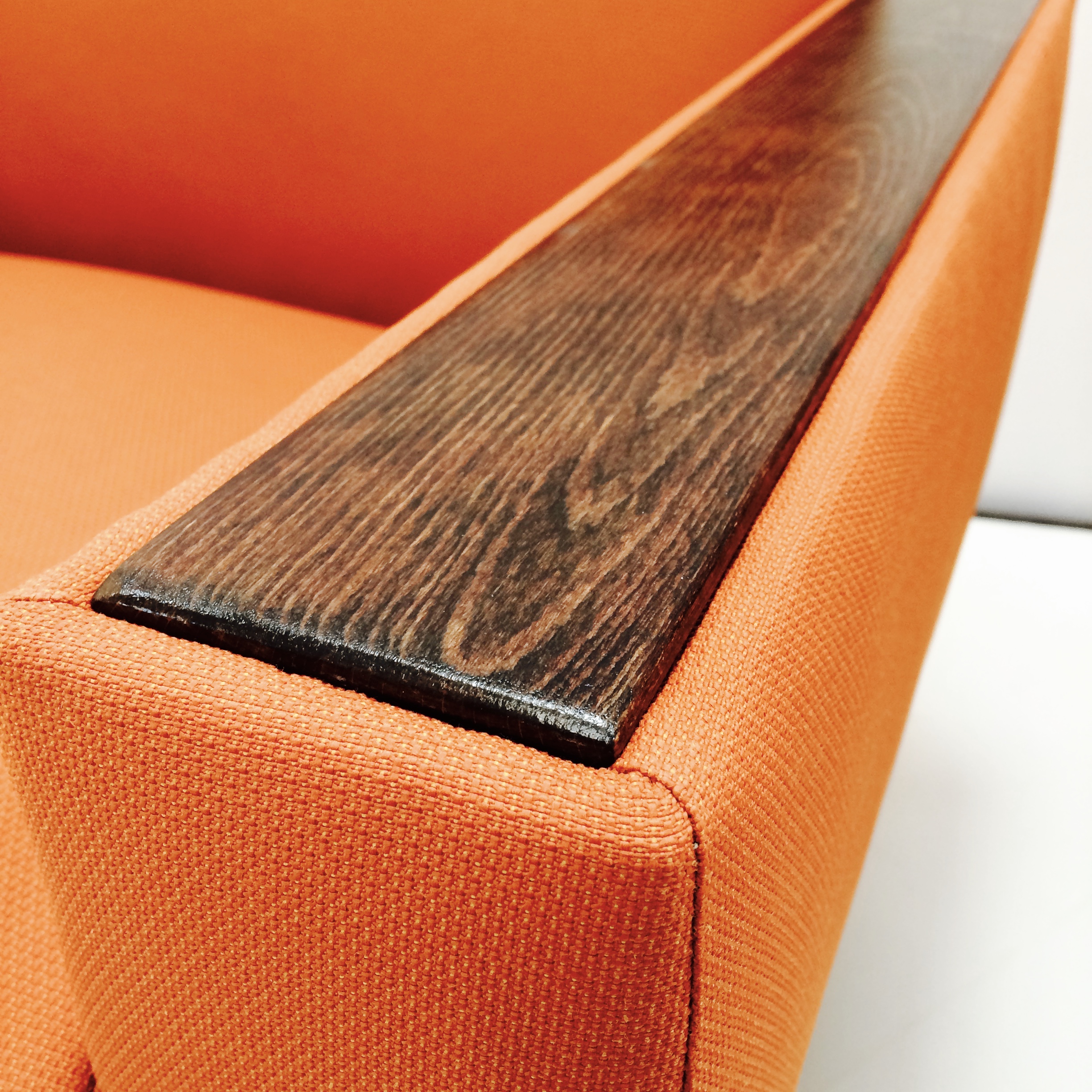 The faded, worn wood arms are given new life.