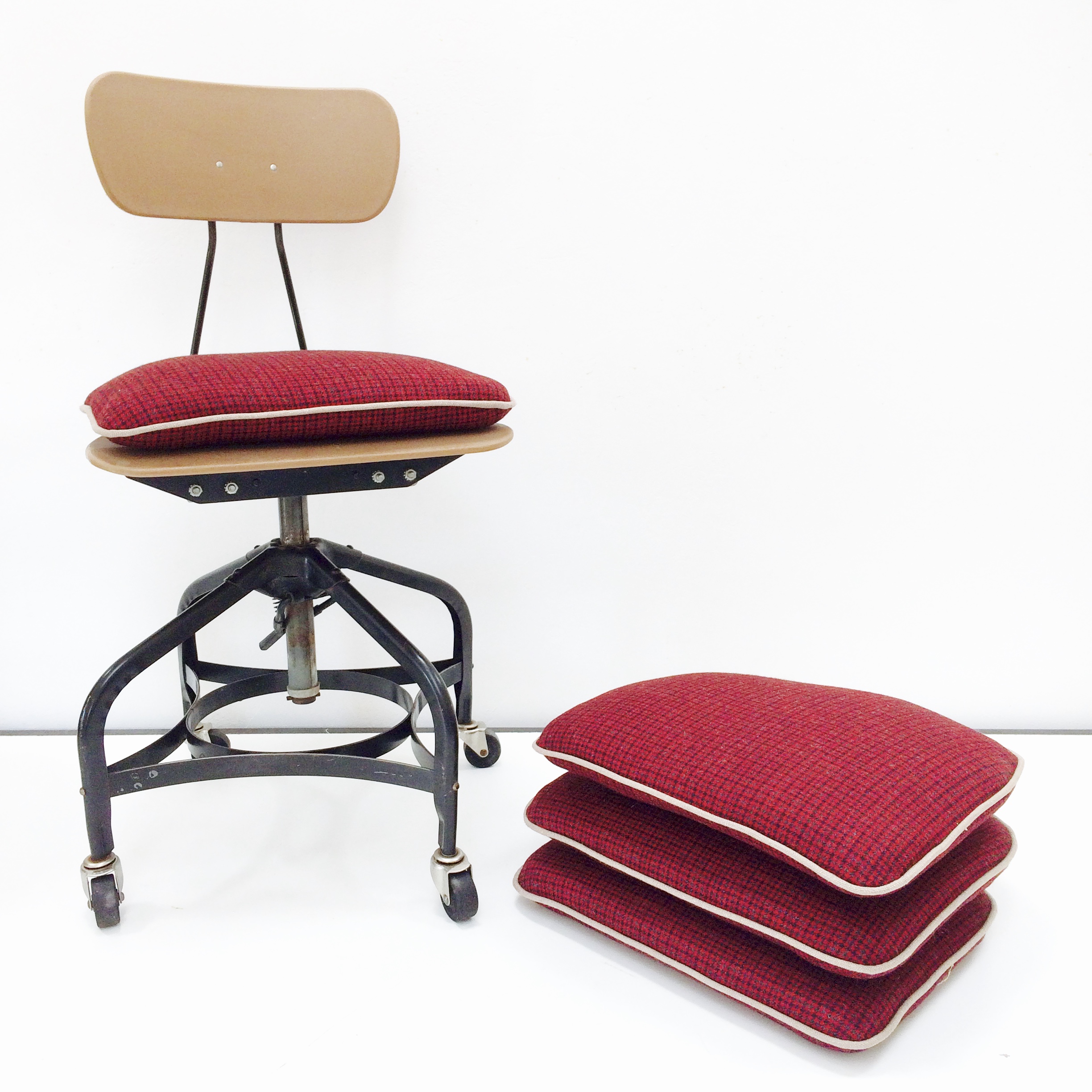 A set of industrial desk chairs is now comfortable and chic enough to become dining chairs.