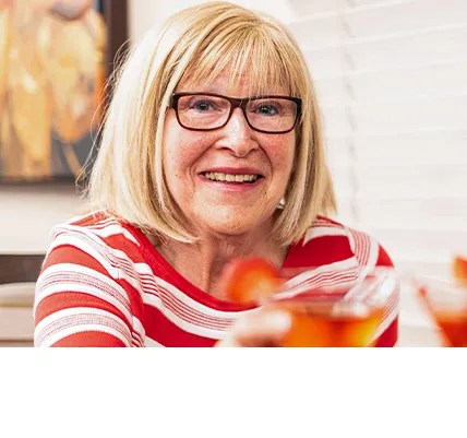 Smiling Canadian senior in striped red and white sweater