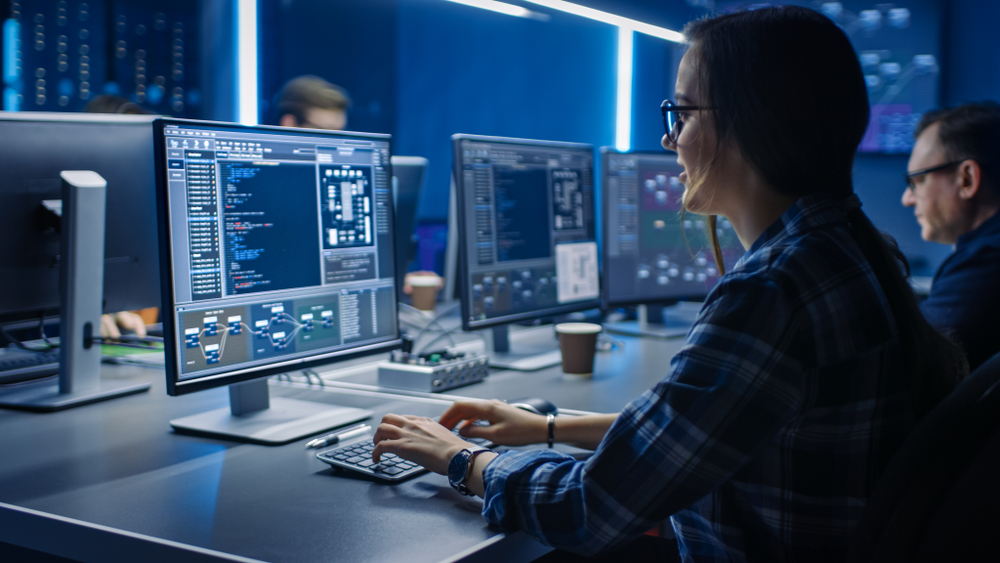 Smart,Female,It,Programer,Working,On,Desktop,Computer,In,Data