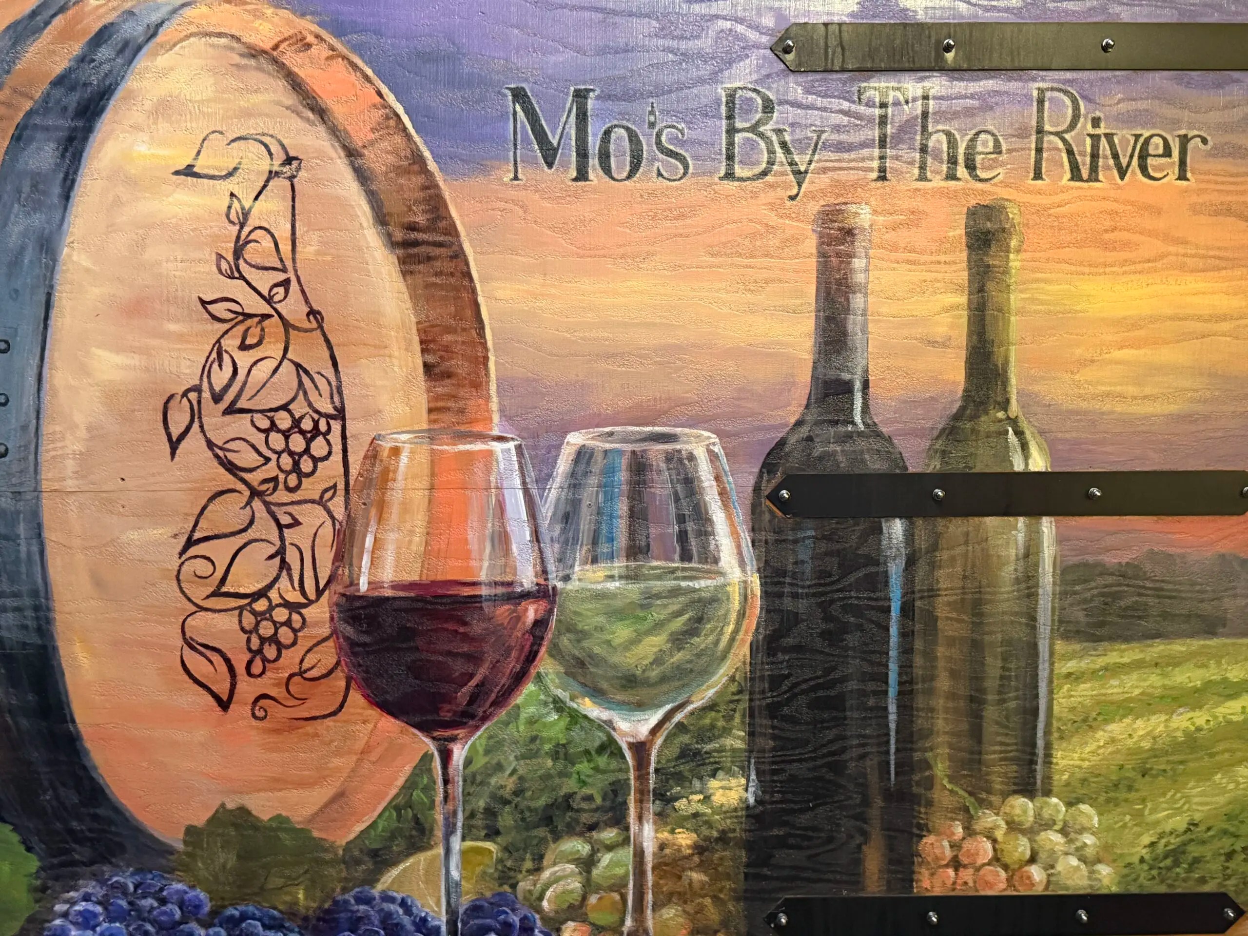 hand-painted wine mural at Mo's By The River in Reno