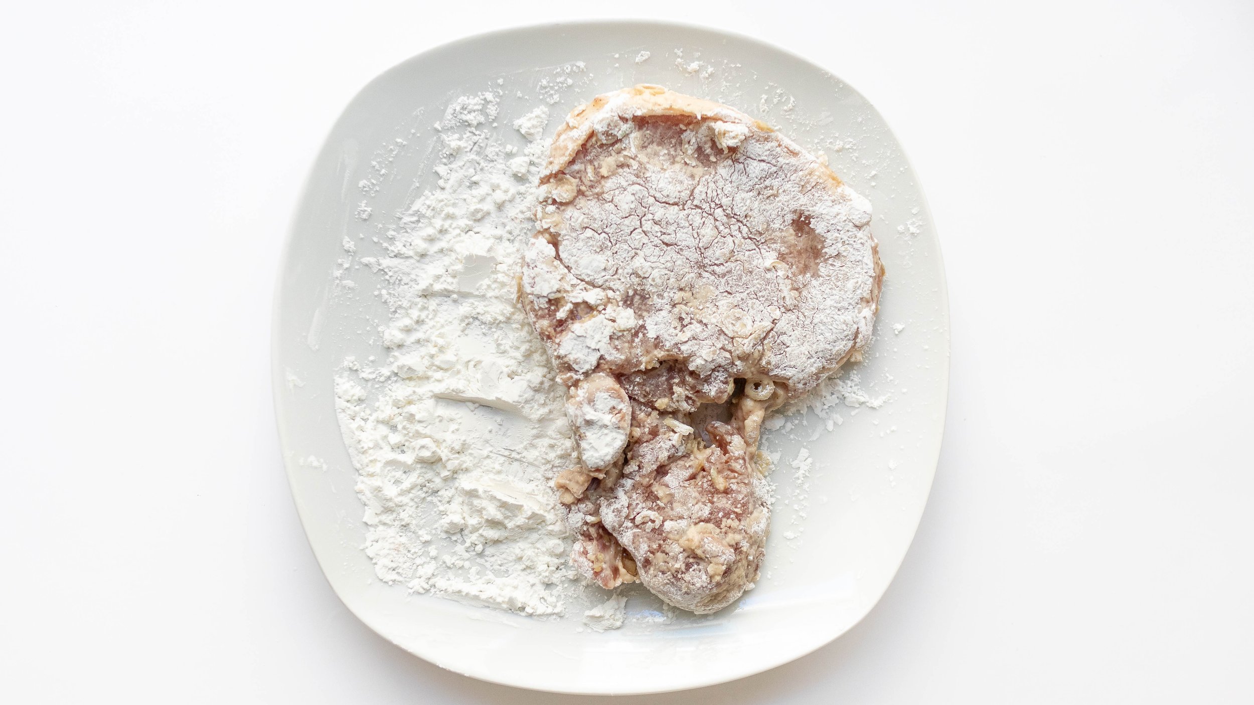 dusting pork chop with corn starch for a crispy crust