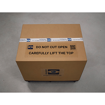 Crate with the wrap and securing strips removed