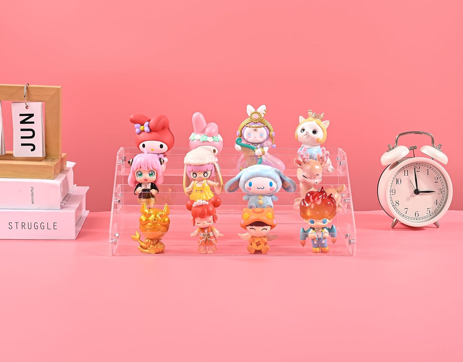 Acrylic riser shelf displaying a perfume collection