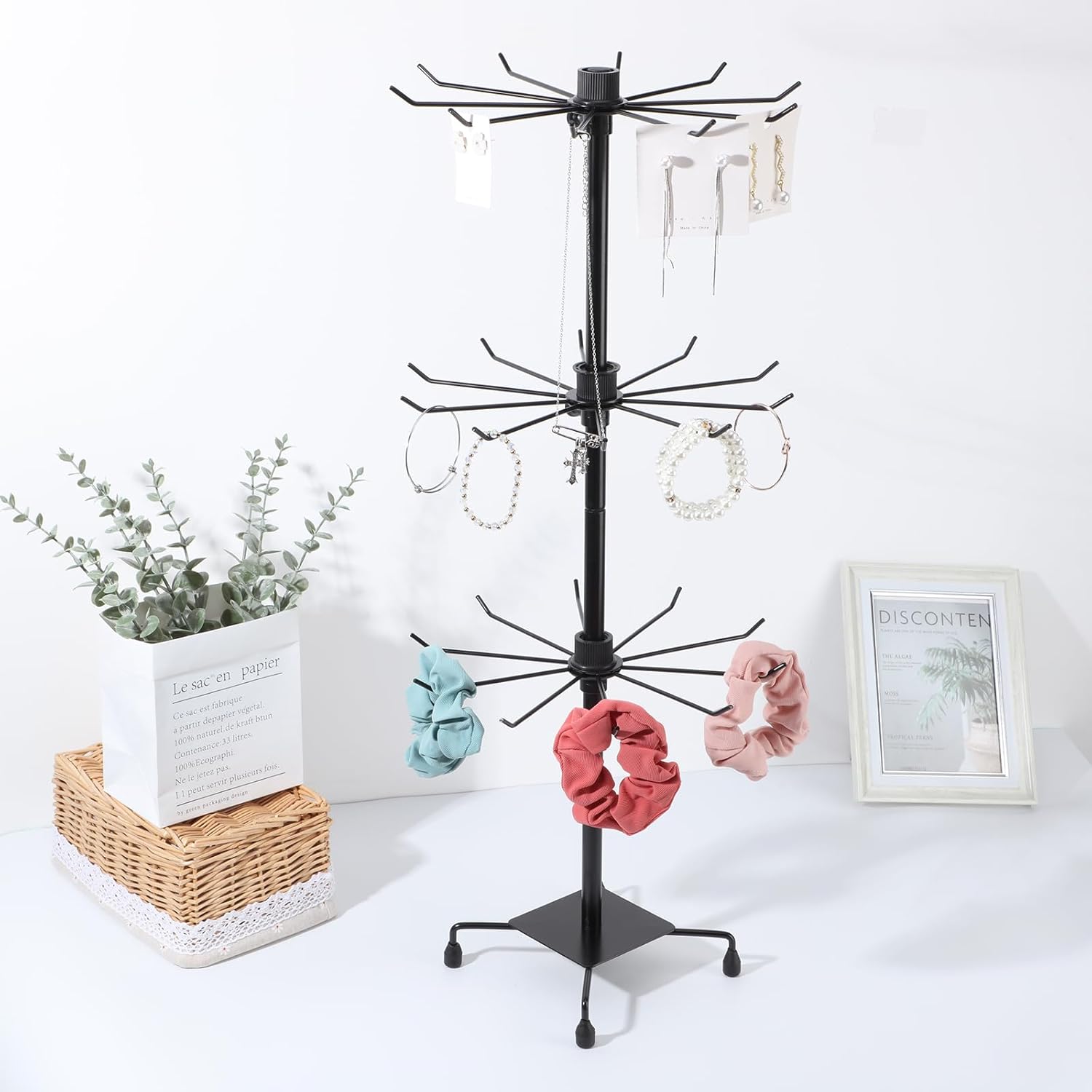 Rotating jewelry stand showcasing necklaces and bracelets