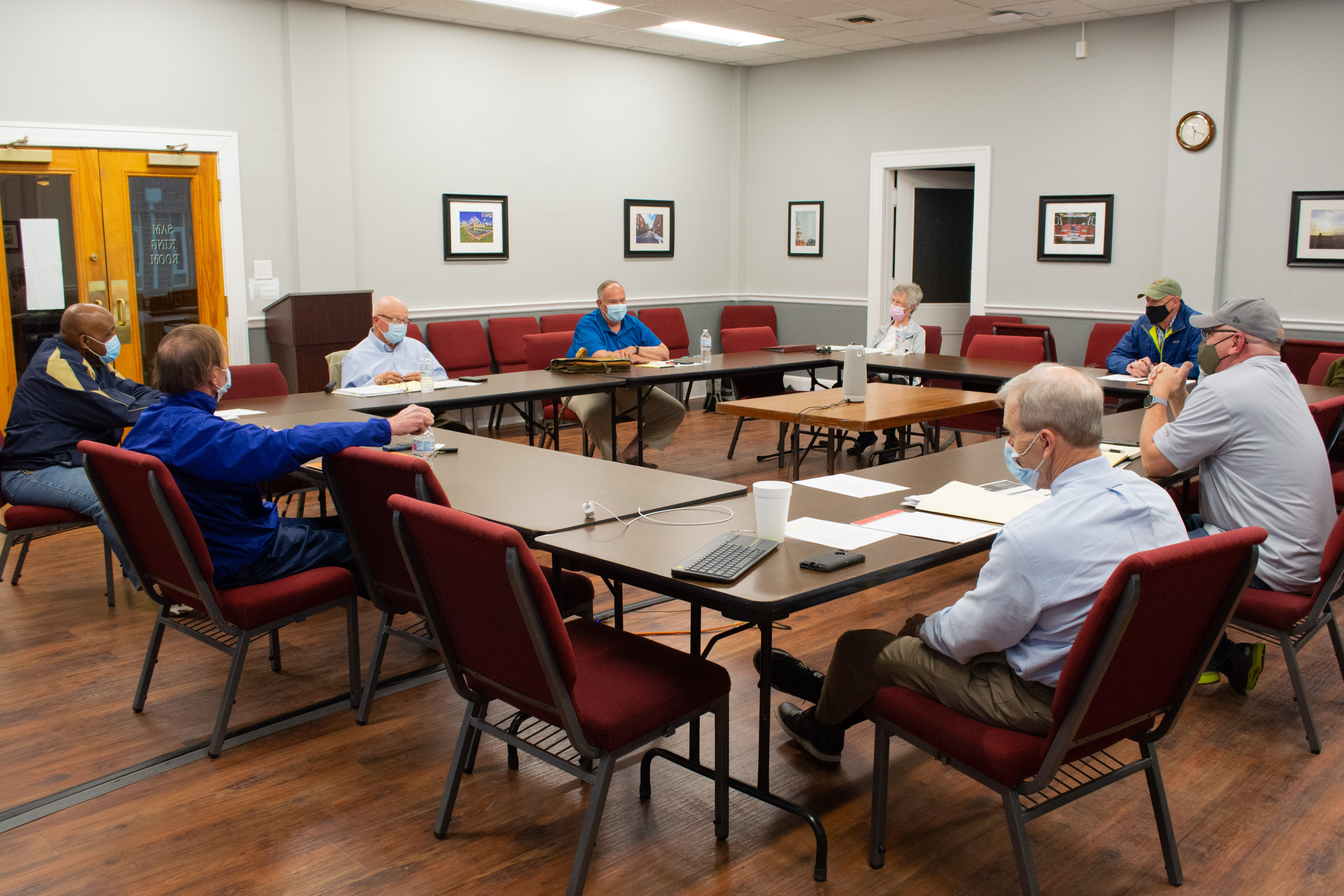The new committee meets in a room at city hall to discuss creating a plaque about the Nathan Bedford Forrest statue.
