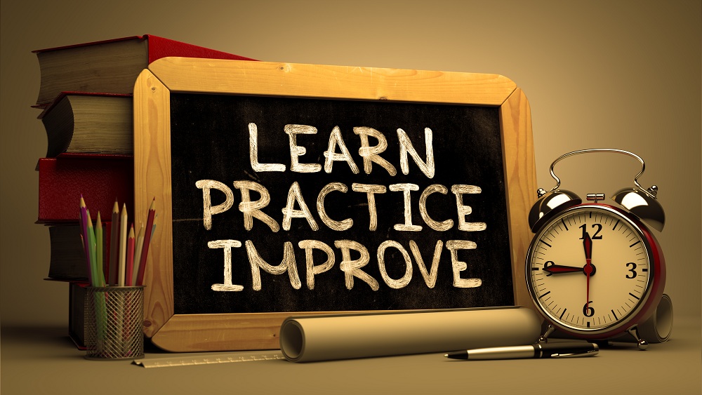 Hand Drawn Learn Practice Improve Concept on Chalkboard. Blurred Background. Toned Image.