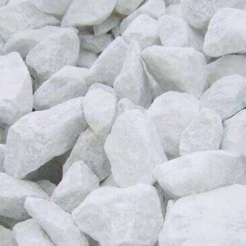 Close-up view of white limestone rocks used as a key raw material in cement production