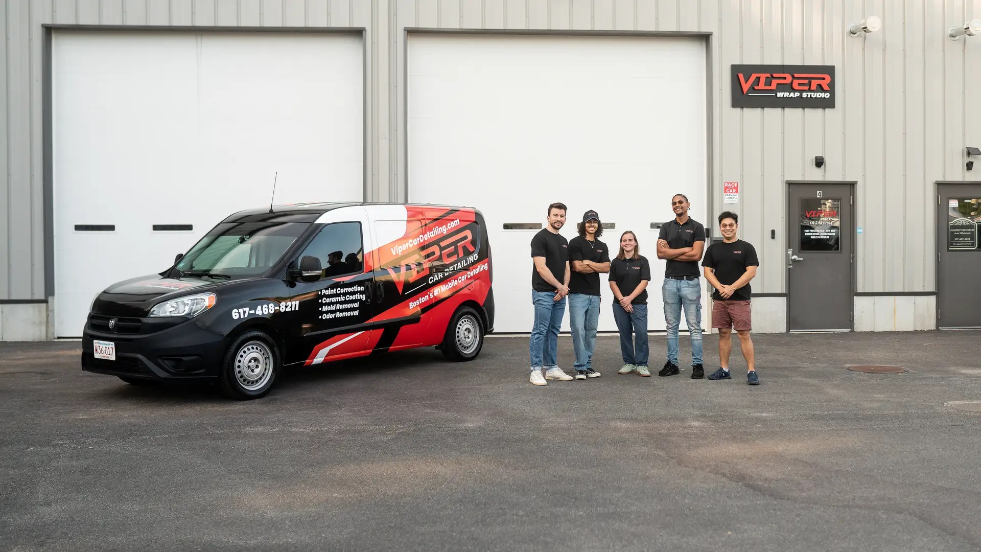 team picture in front of viper wrap studio with the viper car detailing mobile detailing van next to it
