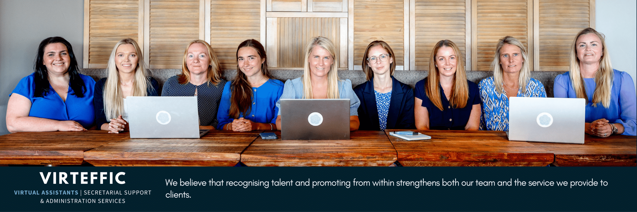 Virteffic team posing together in a professional workplace, showcasing collaboration, governance expertise, and a people-first culture.