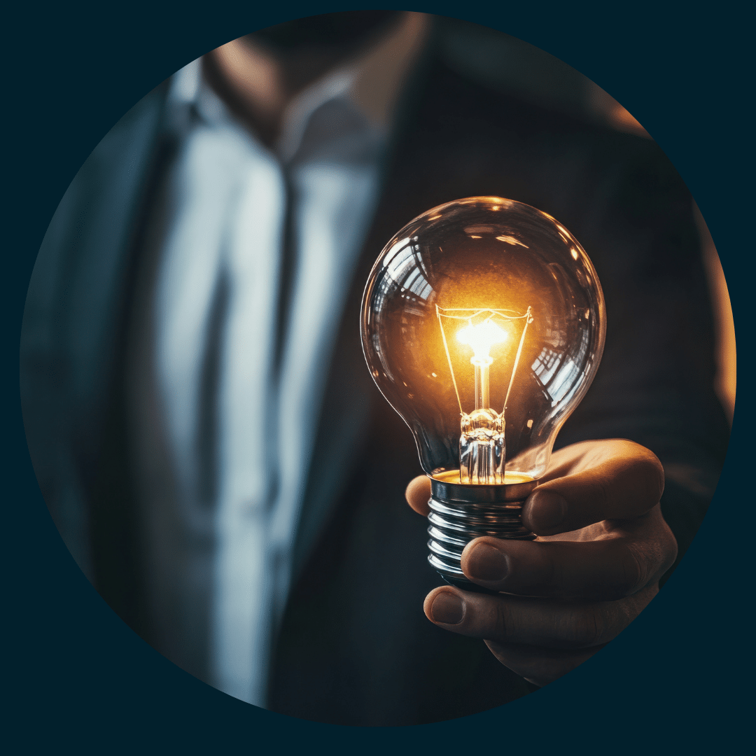 Business professional holding a light bulb representing innovative corporate governance, company secretarial services and board support provided by Virteffic.