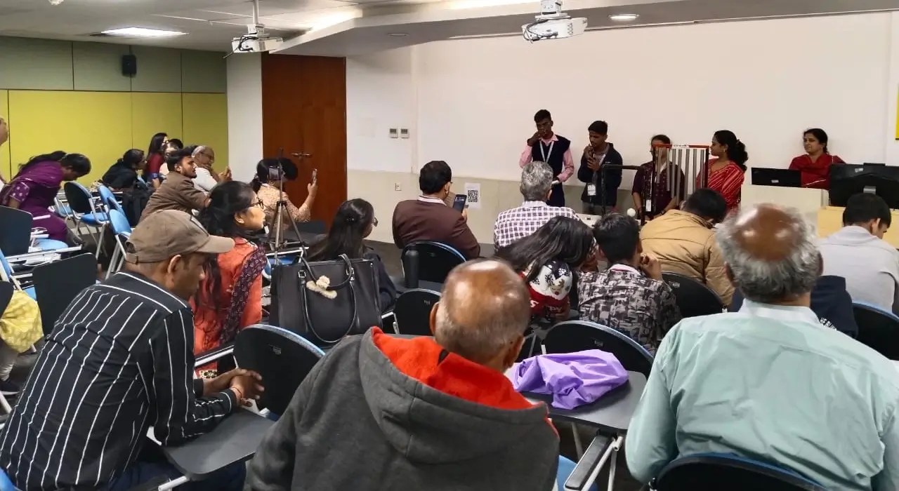 Day 2 of Vision 30 event. A few students and an adult presenting in front of an audience.