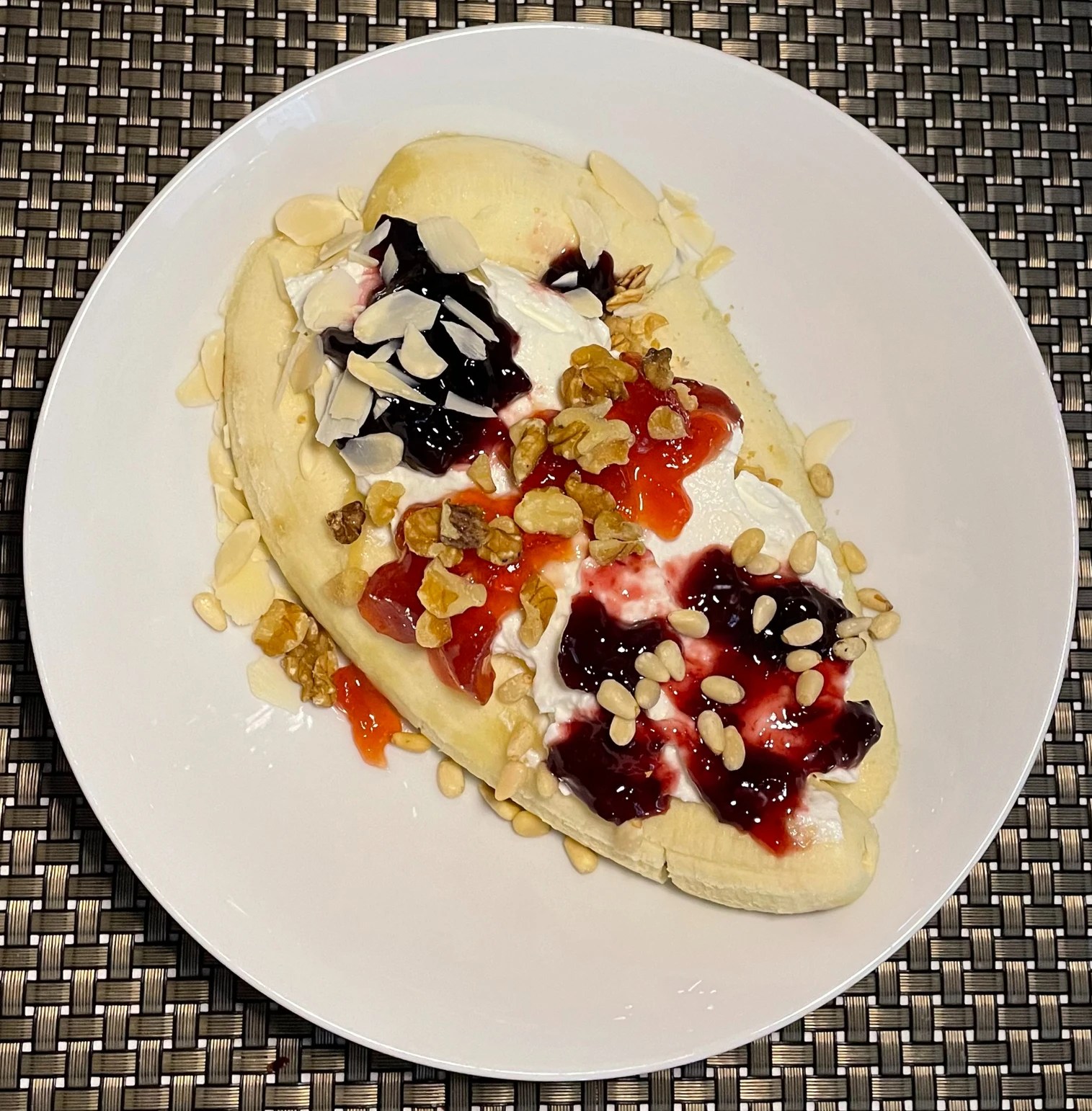 Breakfast banana split with blackberry preserves, strawberry preserves and cherry preserves