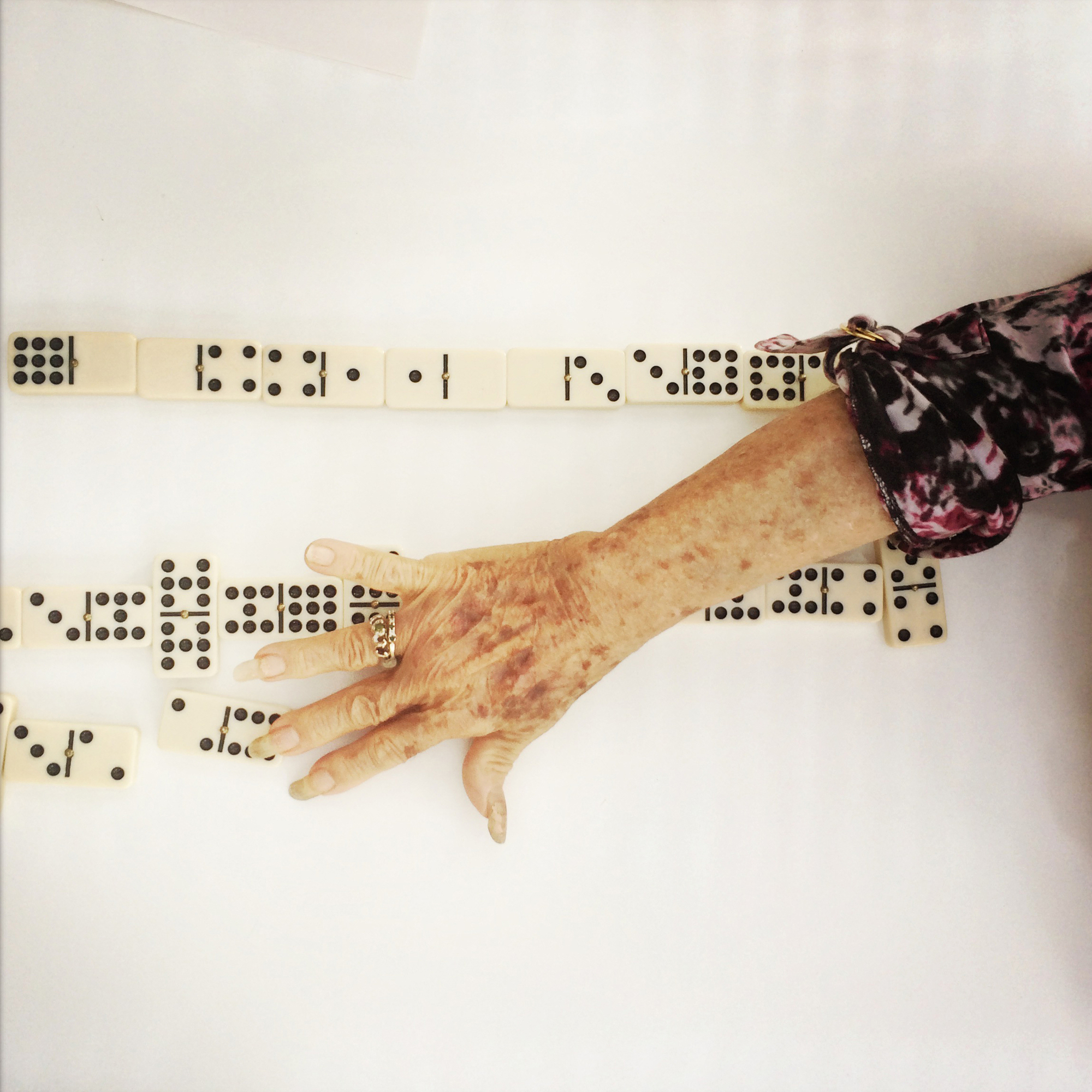 --Pictorial 1st Place: Rich-Joseph Facun/The Virginian-Pilot --Aida Rodriguez plays a game of dominoes at her home in Mission Viejo, California. Aida, a Cuban immigrant.