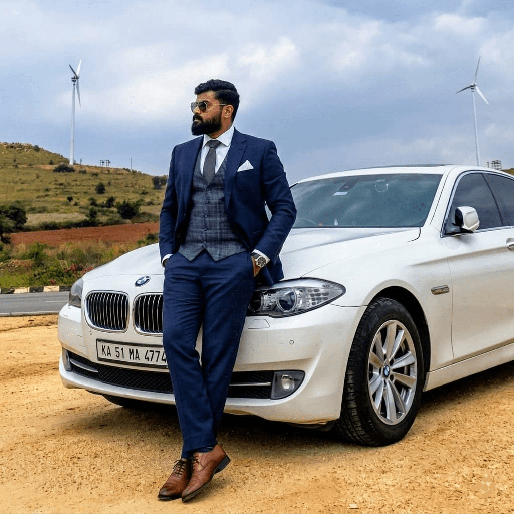 Karthik Maladkar, founder of Vyantech standing with his BMW