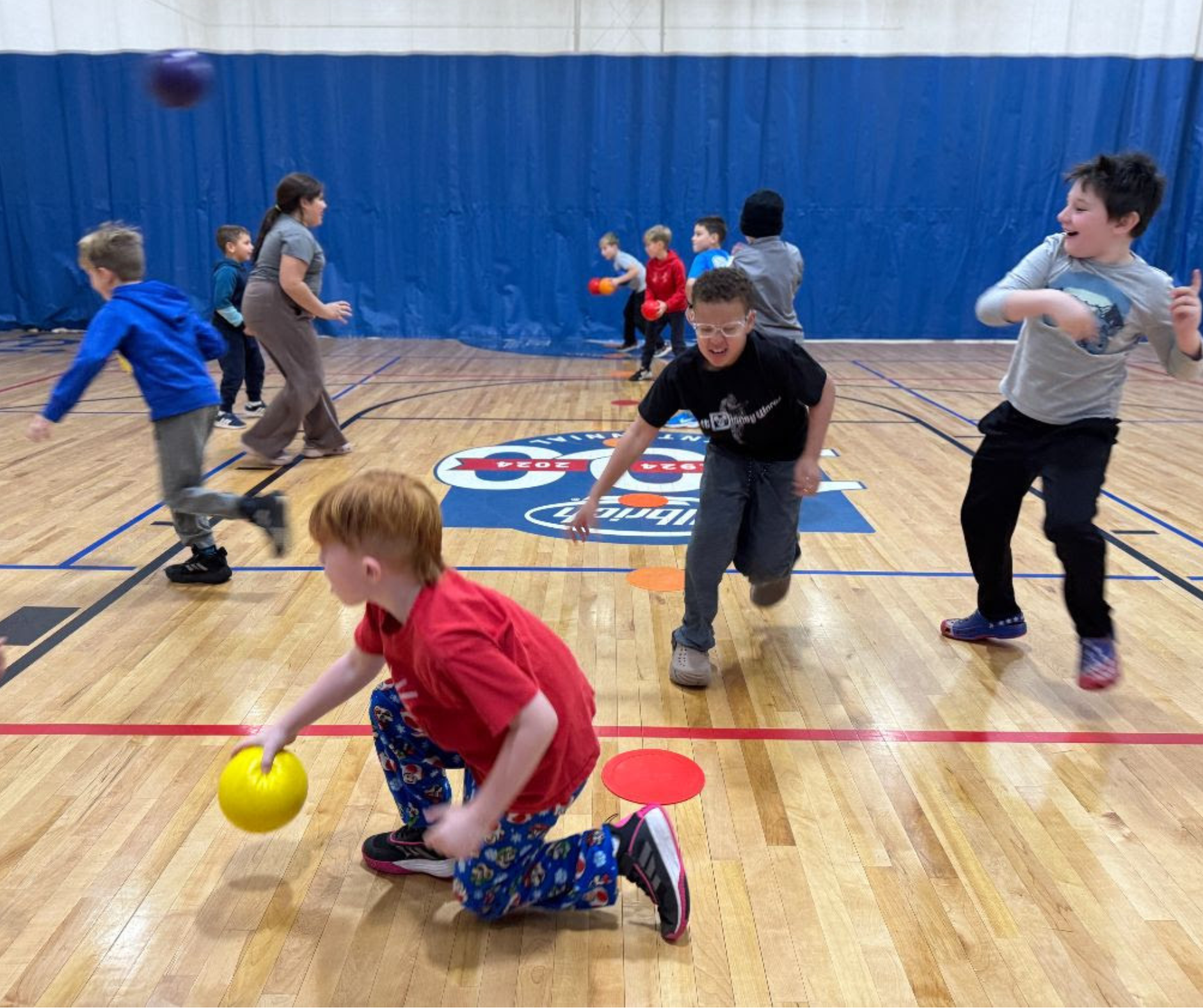 Kids playing Dodgeball in the Gym