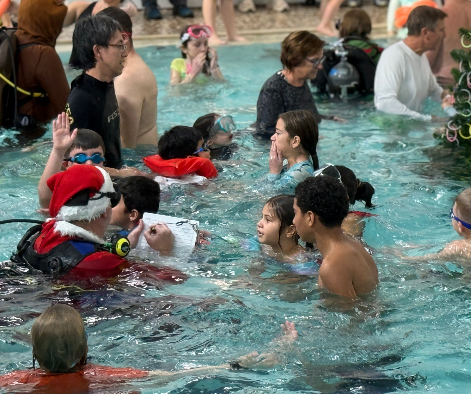 Scuba Santa checking his list