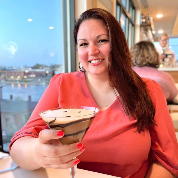 Woman holding a chocolate martini at Rooftop lounge in Oswego