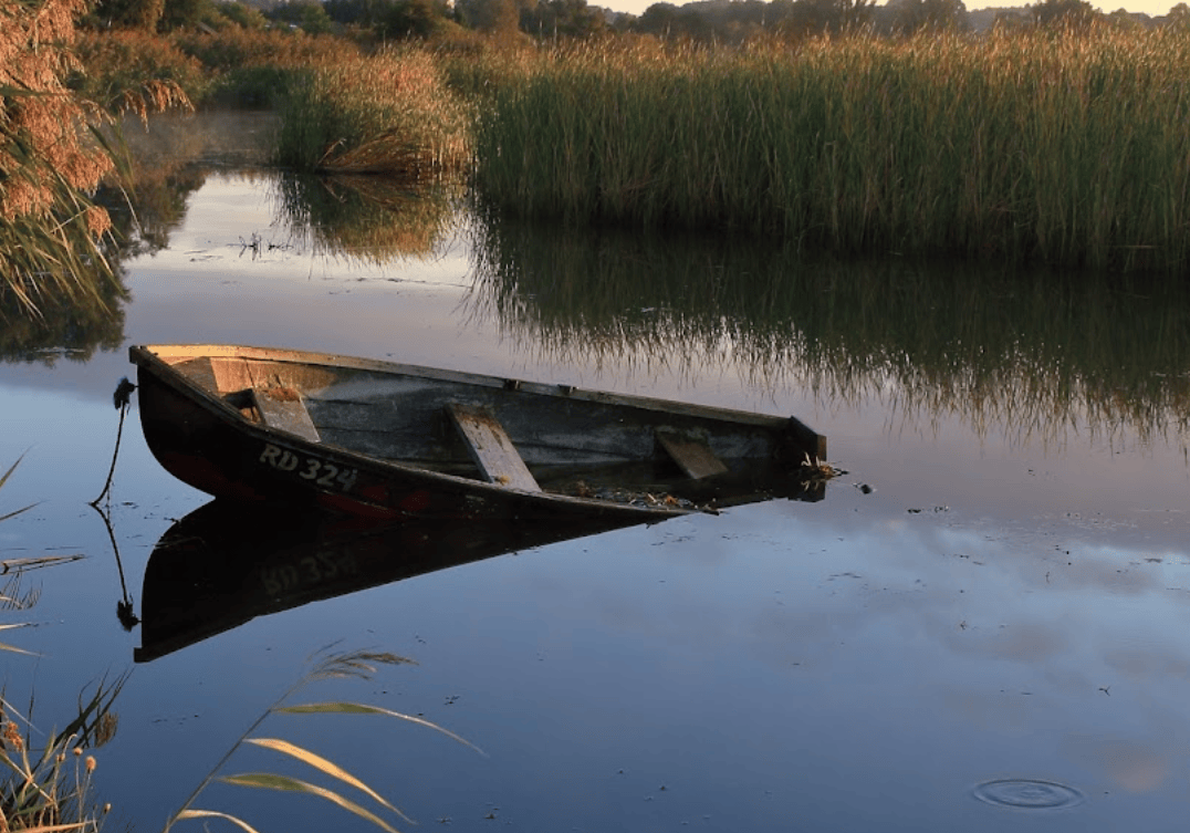 boat partially submerged at Dronningborg Baadelaug