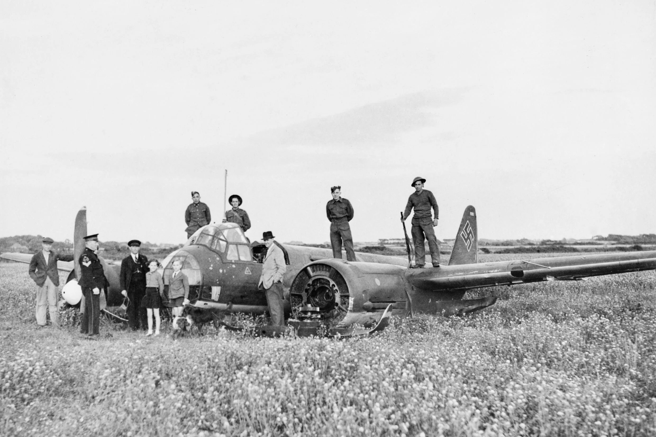 Troops and civilians pose with Junkers Ju 88A-1 (B3+BM) of 4./KG 54