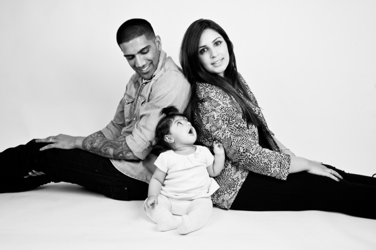 Warm Glow Photo bwbg-3 Black and white studio portrait of a baby girl and her parents by Anna Hindocha/Warm Glow Photo
