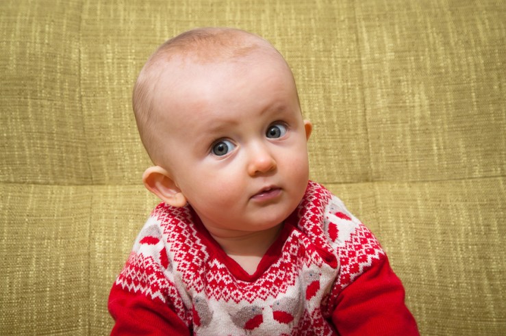 C-128 Portrait of baby girl on sofa at home