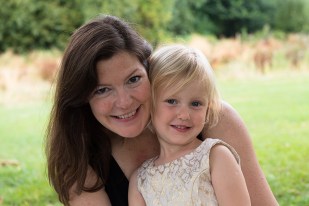 warm-glow-photo-l-271 Young girl in party dress with mother in Belair Park, Dulwich. Photographed by Anna Hindocha/Warm Glow Photo