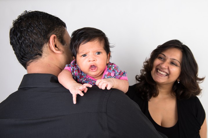 warm-glow-photo-a-2 Studio photo of a newborn baby girl and her parents. Photographed by Anna Hindocha/Warm Glow Photo