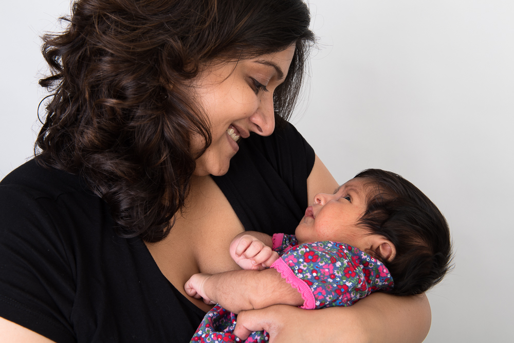 warm-glow-photo-a-3 Studio photo of a newborn baby girl and her mother. Photographed by Anna Hindocha/Warm Glow Photo