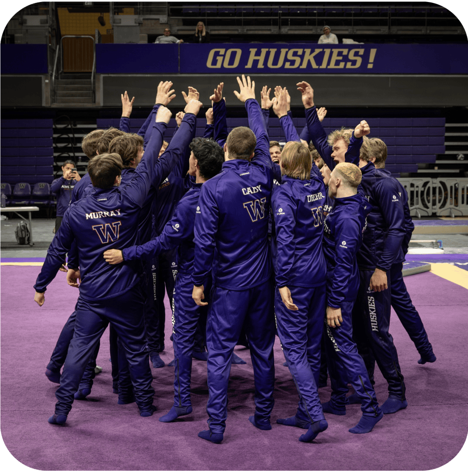 Team slapping hands in a pre-meet cheer