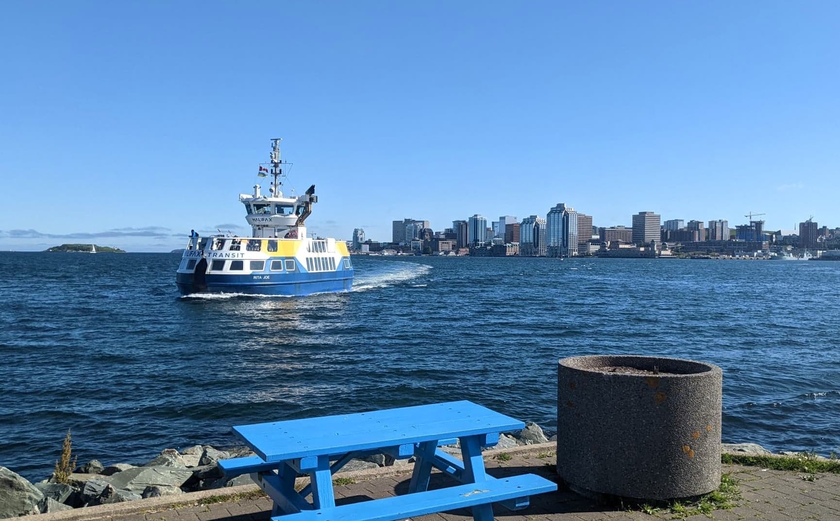 Halifax in the background across the harbour, with the ferry heading to Dartmouth in the foreround