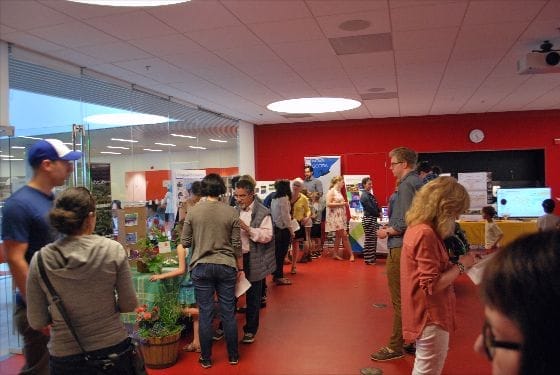 Picture showing Lindsay childrens room with applicants displays set up and voters talking to applicants.
