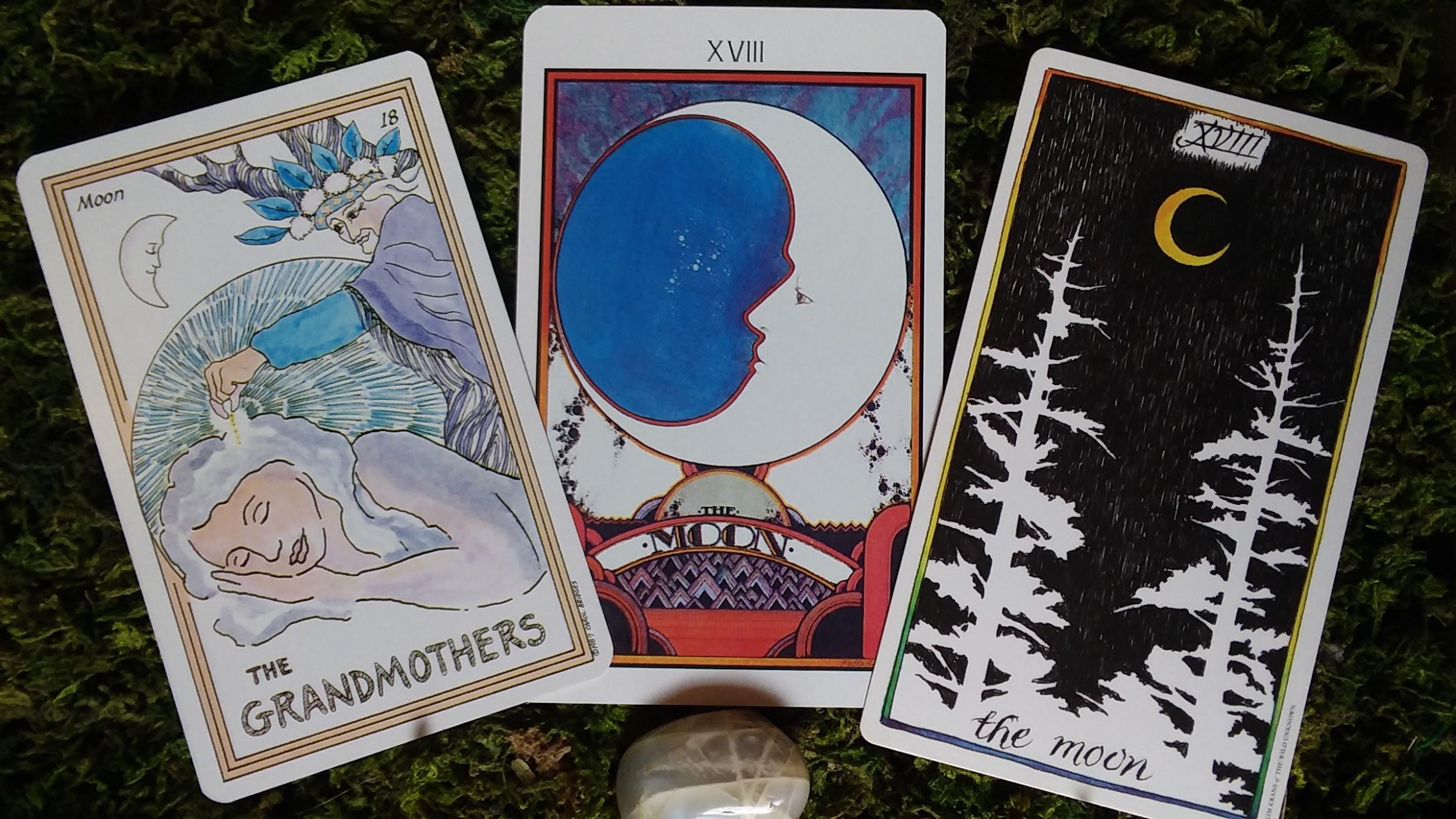 tarot cards featuring the moon with crystal stone